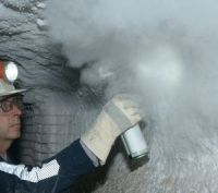 Miner using rock dust to prevent coal dust explosions. Image courtesy of the Centers for Disease Control and Prevention, National Institute for Occupational Safety and Health.